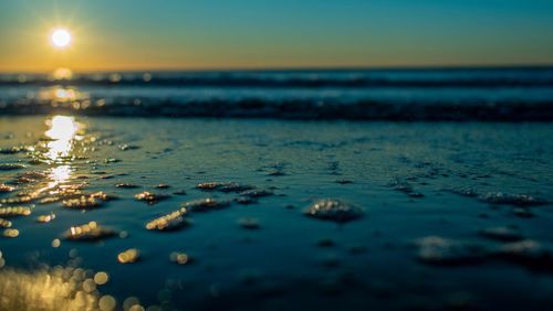 Scenic view of sea against sky at sunset