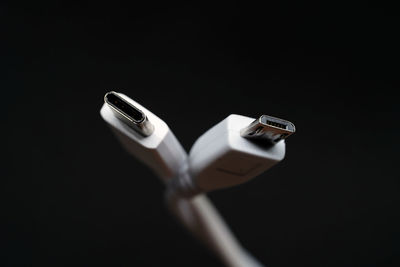 High angle view of smart phone against black background