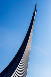 Low angle view of modern building against clear blue sky