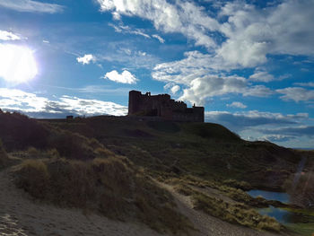Scenic view of landscape against cloudy sky