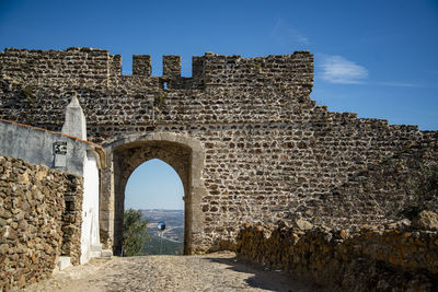 Low angle view of old ruins against clear sky