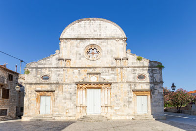 View of historical building against clear blue sky