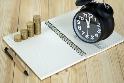 High angle view of clock on table