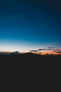 Silhouette landscape against sky during sunset