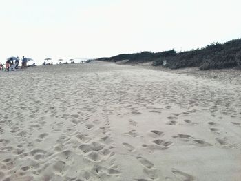 Scenic view of beach against clear sky