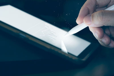 Midsection of person using smart phone