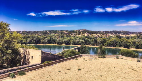 Scenic view of lake against blue sky