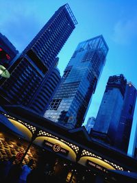 Low angle view of modern buildings against sky