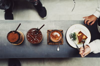 High angle view of person having food on table