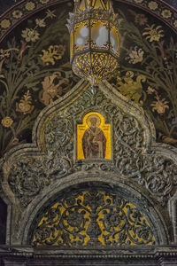 Low angle view of ornate sculpture on building