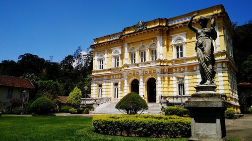 Facade of historic building against clear blue sky