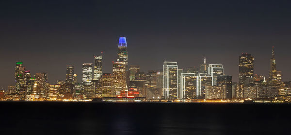 Illuminated buildings in city at night