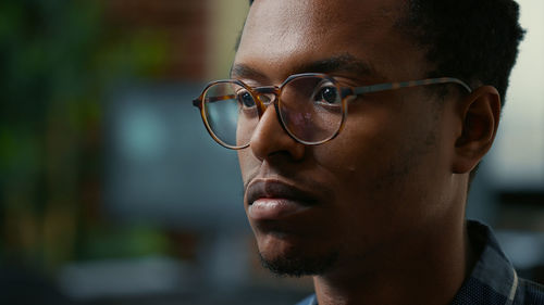 Close-up of young man wearing sunglasses