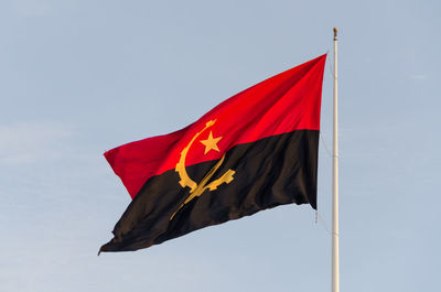 Low angle view of flag against sky