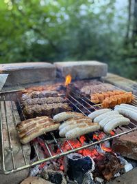 High angle view of meat on barbecue grill