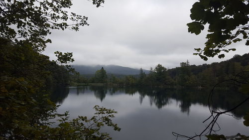 Scenic view of lake with mountains in background