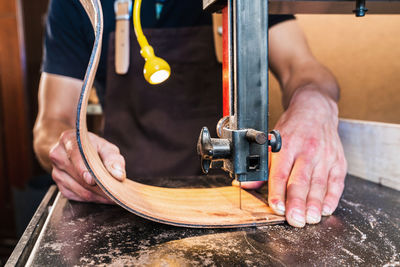 Midsection of man working at home