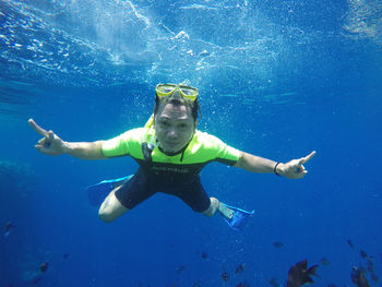 Portrait of man swimming in sea