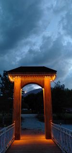 Illuminated bridge against sky at sunset