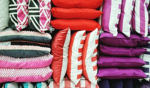 Close-up of multi colored cushions at store for sale