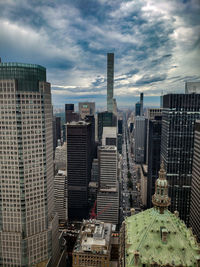 High angle view of buildings in city against sky