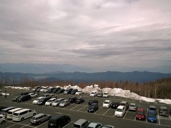 High angle view of cars on road against sky