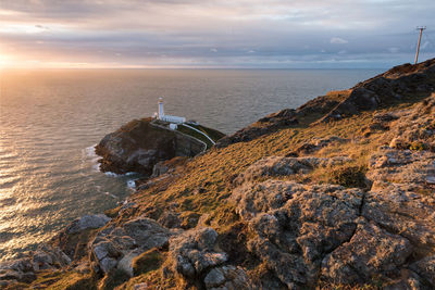 Scenic view of sea against sky at sunset