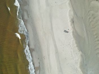 High angle view of sand at beach