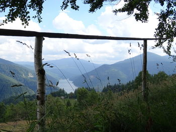 Scenic view of landscape against cloudy sky