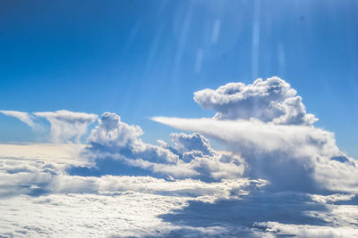 Low angle view of clouds in blue sky on sunny day