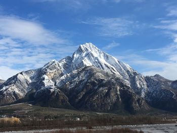 Scenic view of snowcapped mountains against sky