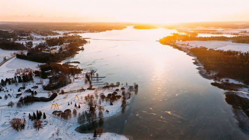 High angle view of frozen lake during sunset