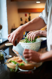 Midsection of woman preparing food on table