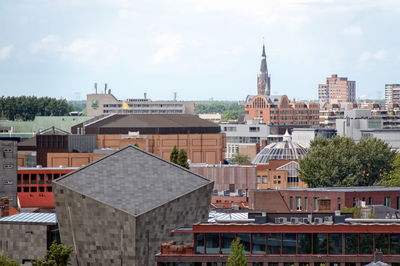 Buildings in city against sky