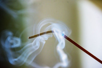 Close-up of smoke emitting incense