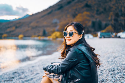 Portrait of young woman in sunglasses