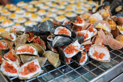 High angle view of fish on barbecue grill