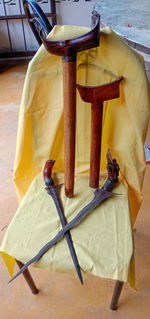 High angle view of yellow container on table