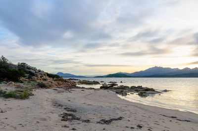 Scenic view of beach against sky during sunset