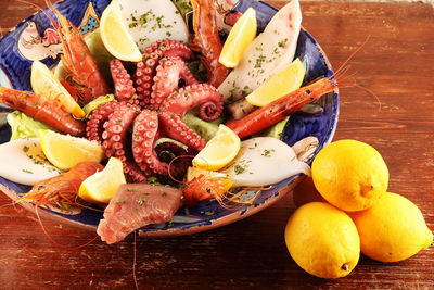 Close-up of fruits in plate on table