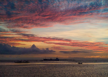 Scenic view of sea against orange sky
