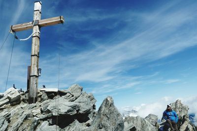 Cross on rock at hochfeiler against sky