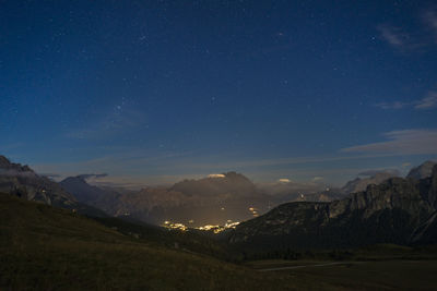 Scenic view of mountains against sky at night