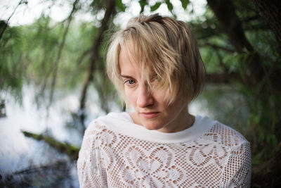 Portrait of woman against plants