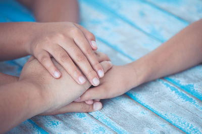 Close-up of hand holding hands