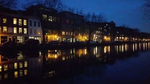 Reflection of illuminated buildings in water at night