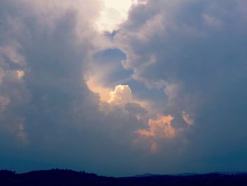 Scenic view of landscape against cloudy sky