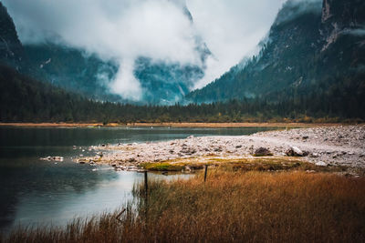 Scenic view of lake and mountains against sky
