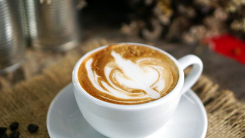 Close-up of cappuccino on table