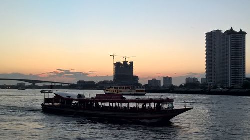 View of ship in sea at sunset